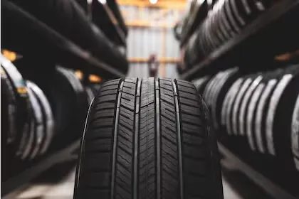 a-new-tire-is-placed-on-the-tire-storage-rack-in-YIOMVEVIYJE57OZYH2KBSEDLGI
